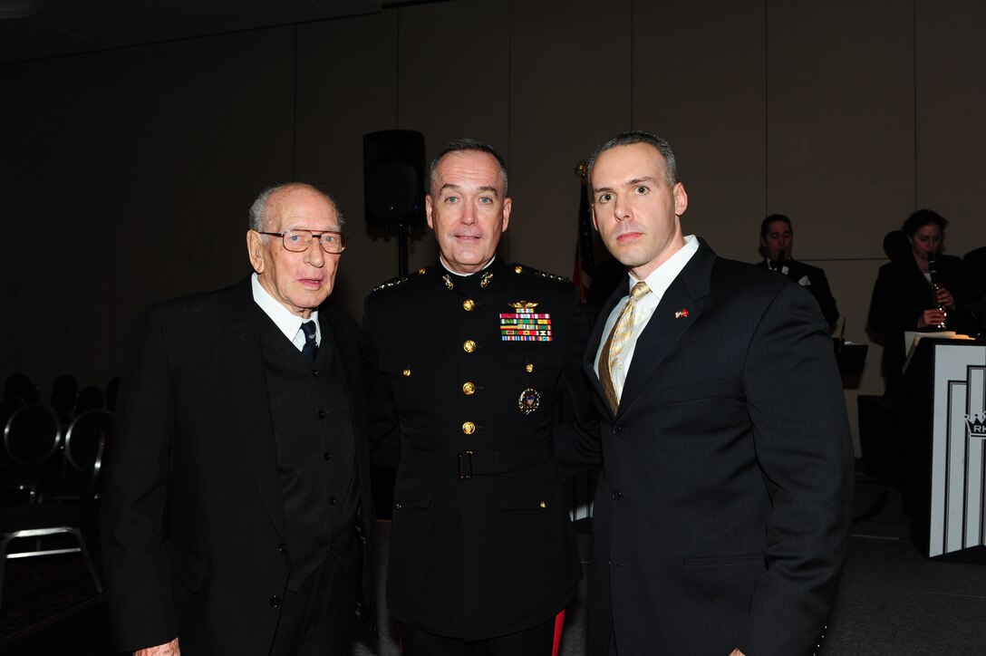 Assistant Commandant of the Marine corps Gen Joseph F. Dunford stands with Marine Master Sergeant Mark Shaffer and his grandfather, an Army veteran of Europe at the Iwo Jima 67th Anniversary Reunion in Arlington, Va on Feb 18, 2012.(Official Marine Photo by Cpl Scott R Picklesimer/Released)